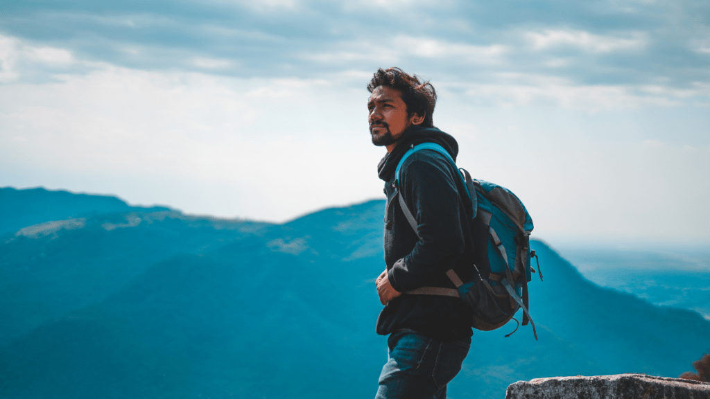 man standing on cliff