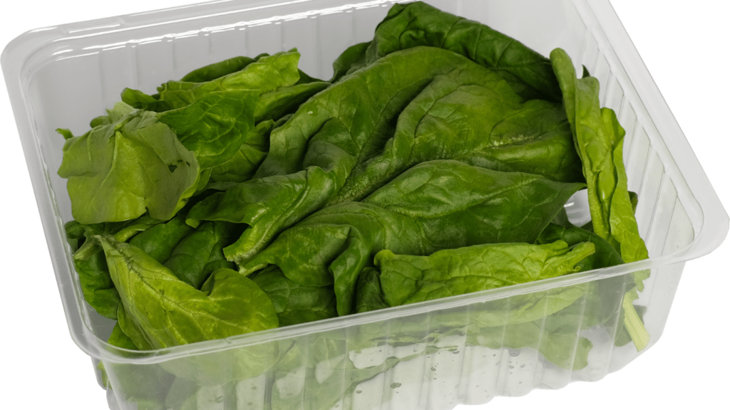 a plastic container filled with vegetables