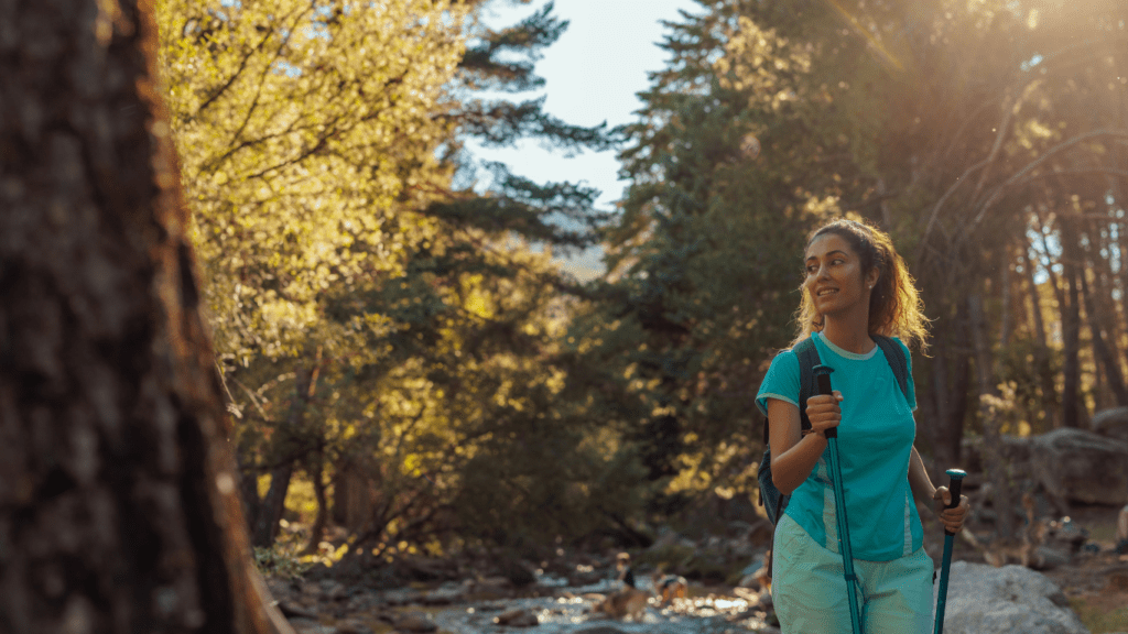 a person with a backpack walking through a forest