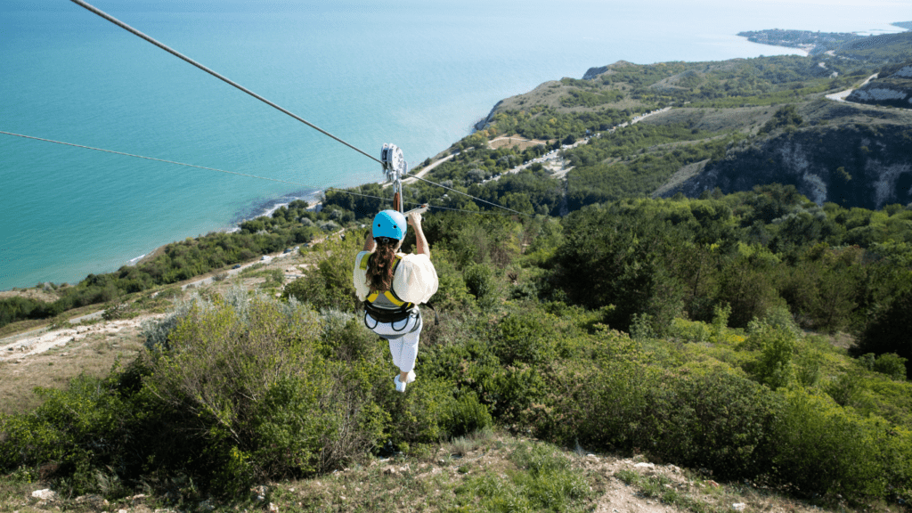 a person riding on a zipline