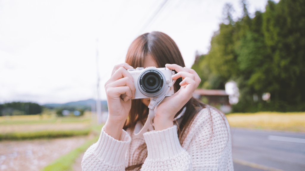 a person taking a picture with a camera