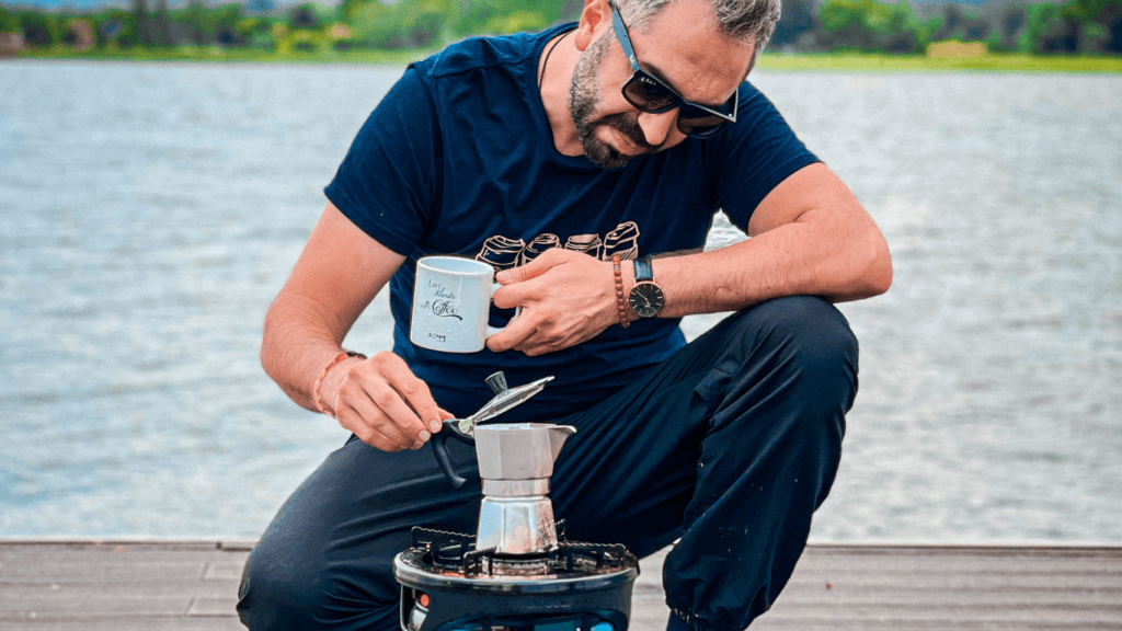 a person holding a kettle