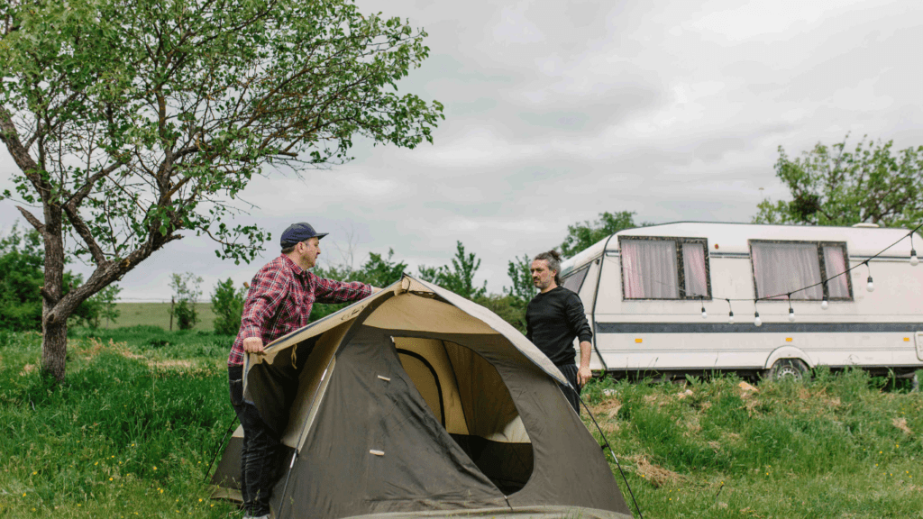 Two people standing in front of a van