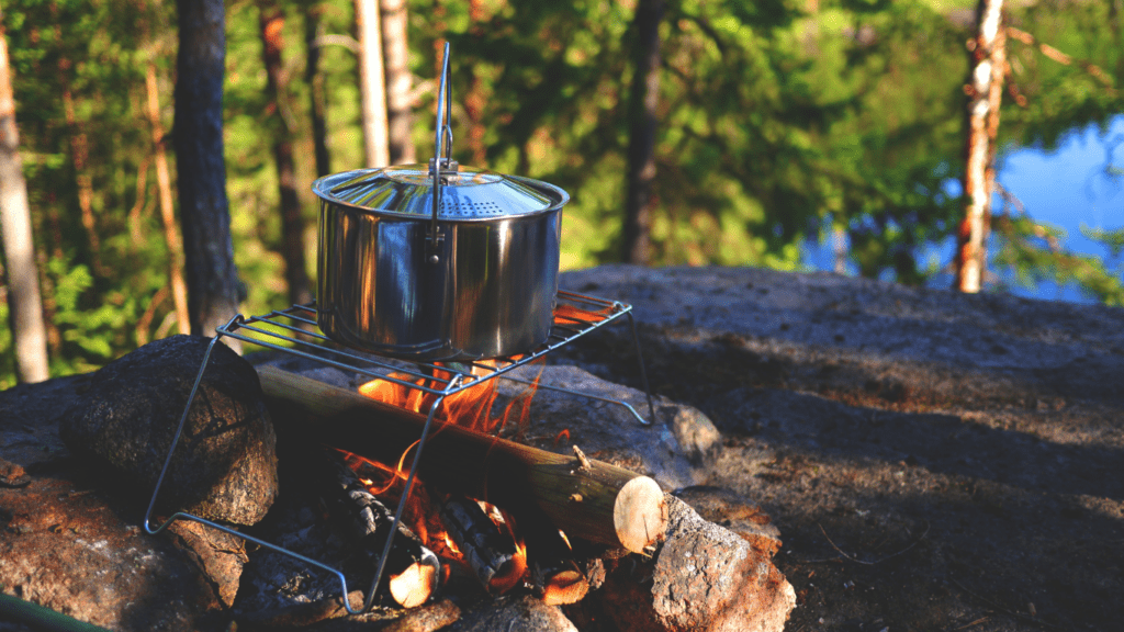 cooking pot on a campfire in the woods