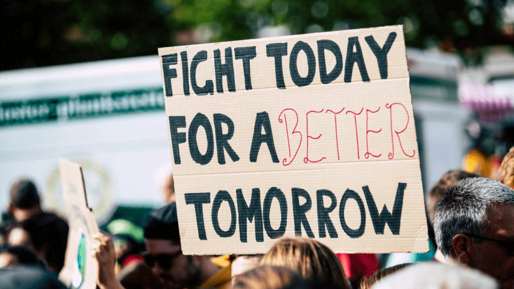 a group of people holding signs