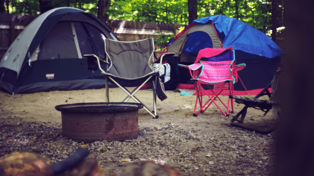 a group of tents set up in the woods at night