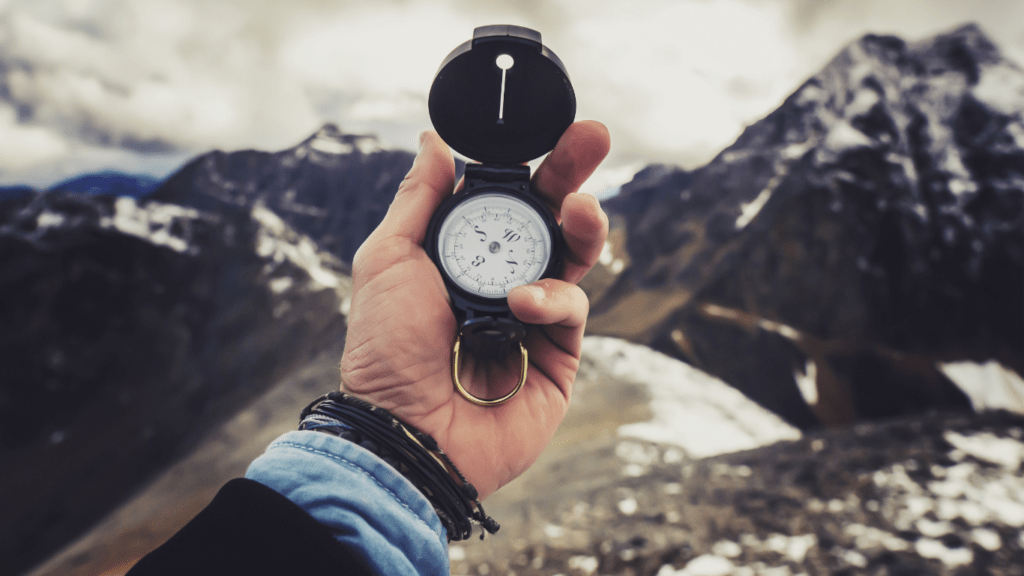 a person holding a compass