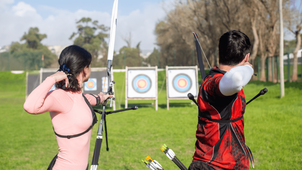 an archer aiming at a target with a bow and arrow