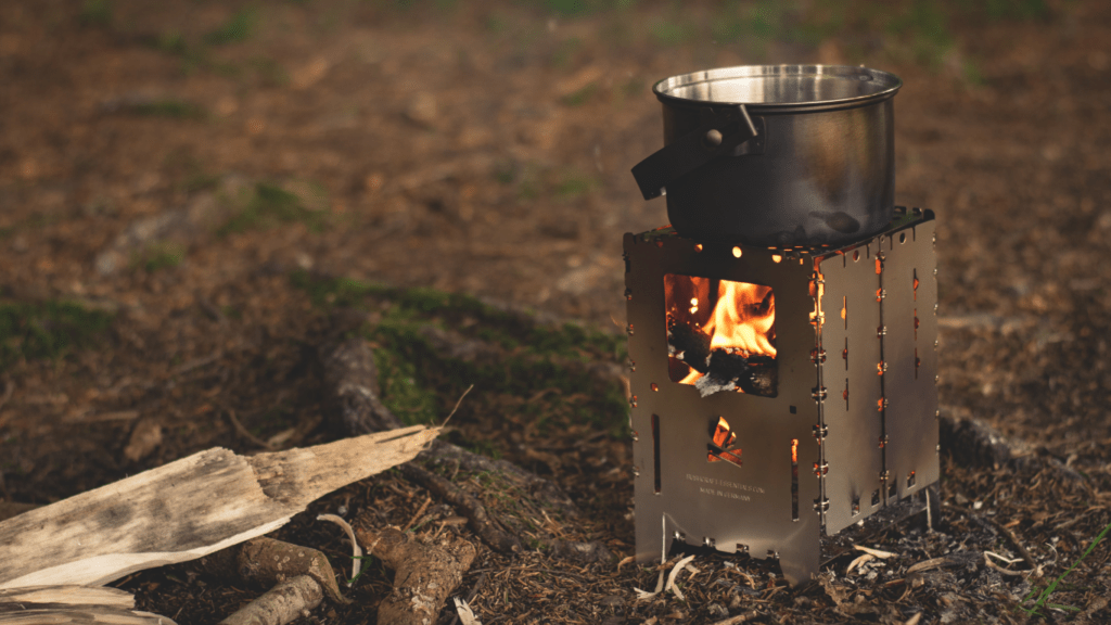 cooking pot on a campfire in the woods